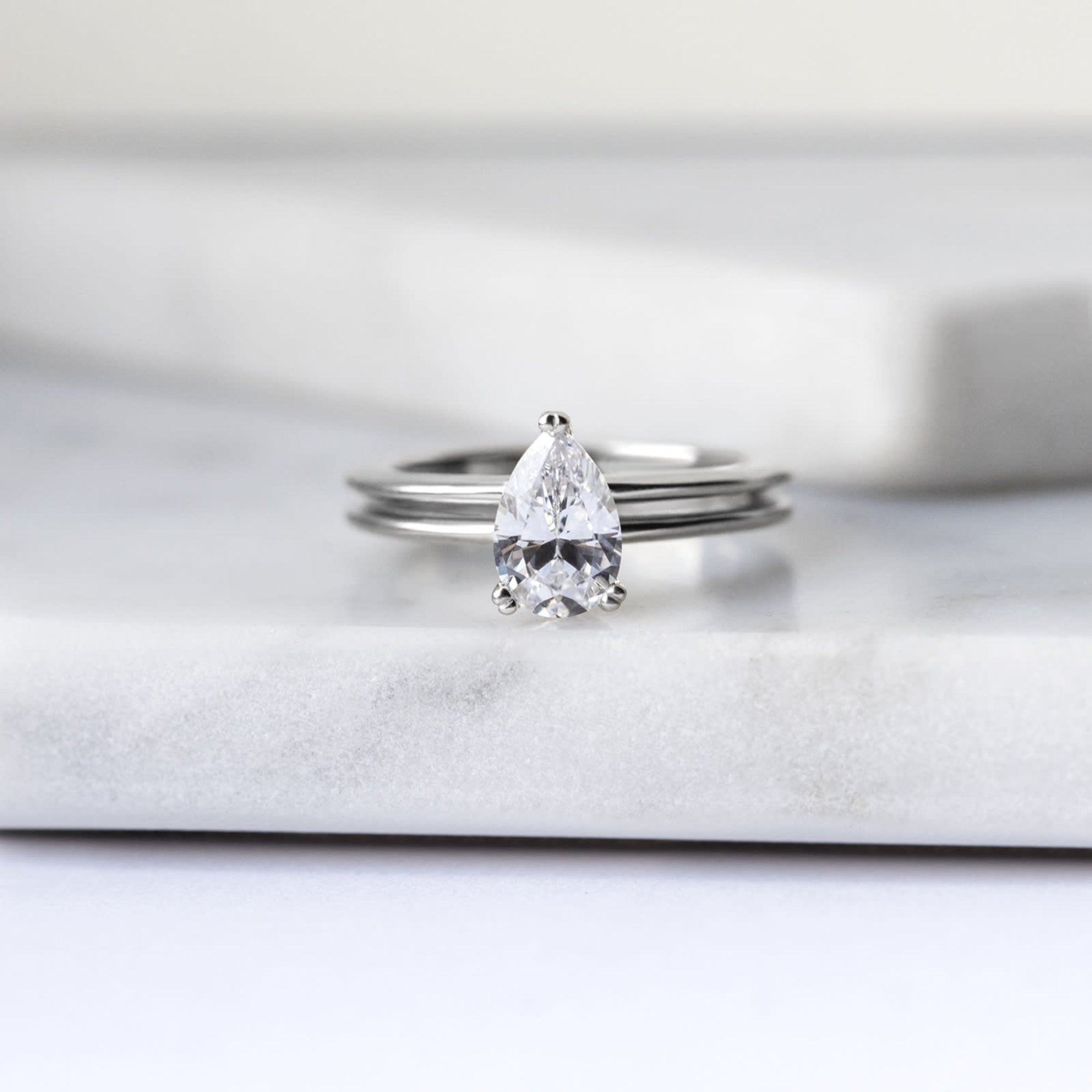 Sleek Shank Pear Cut Solitaire Engagement Ring