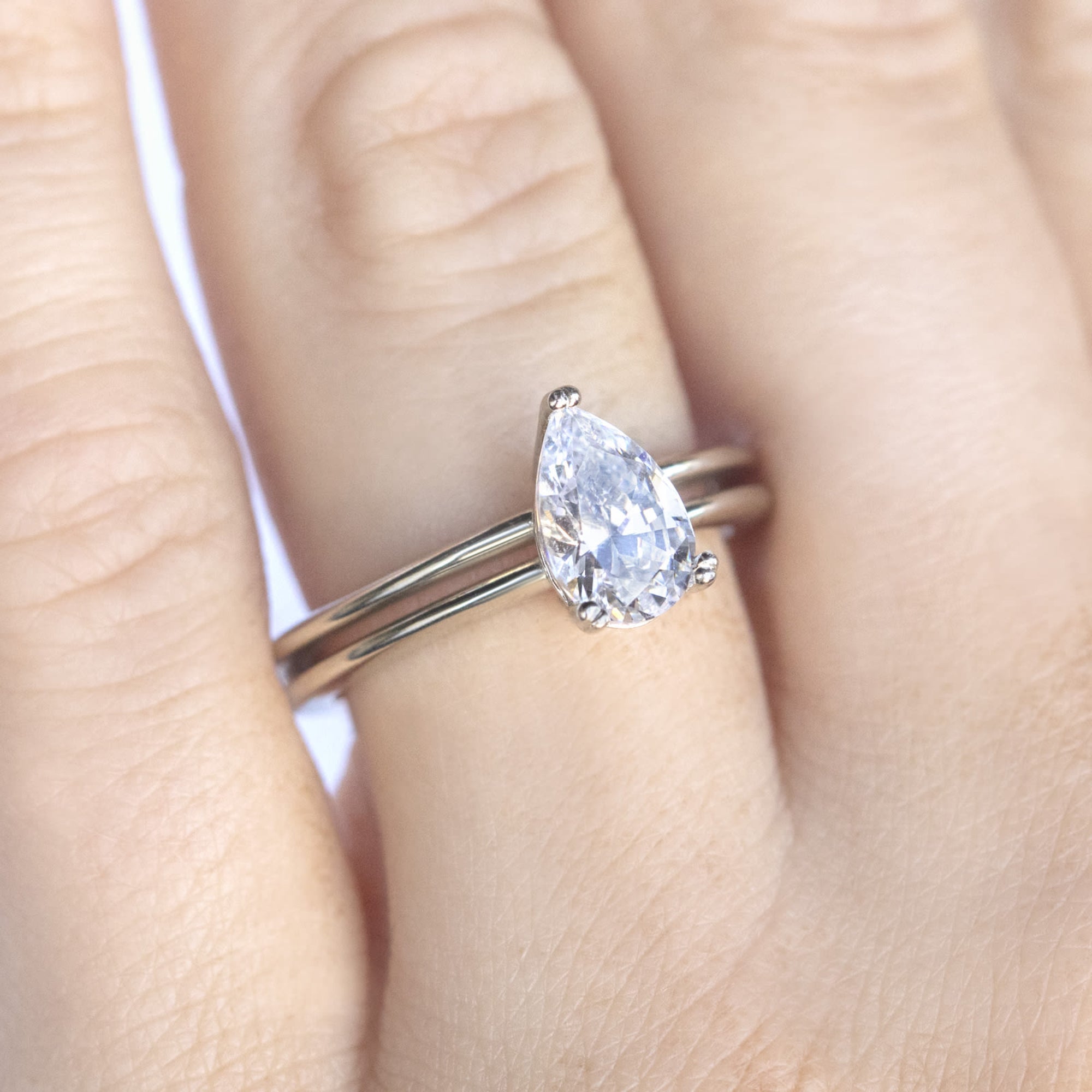 Sleek Shank Pear Cut Solitaire Engagement Ring