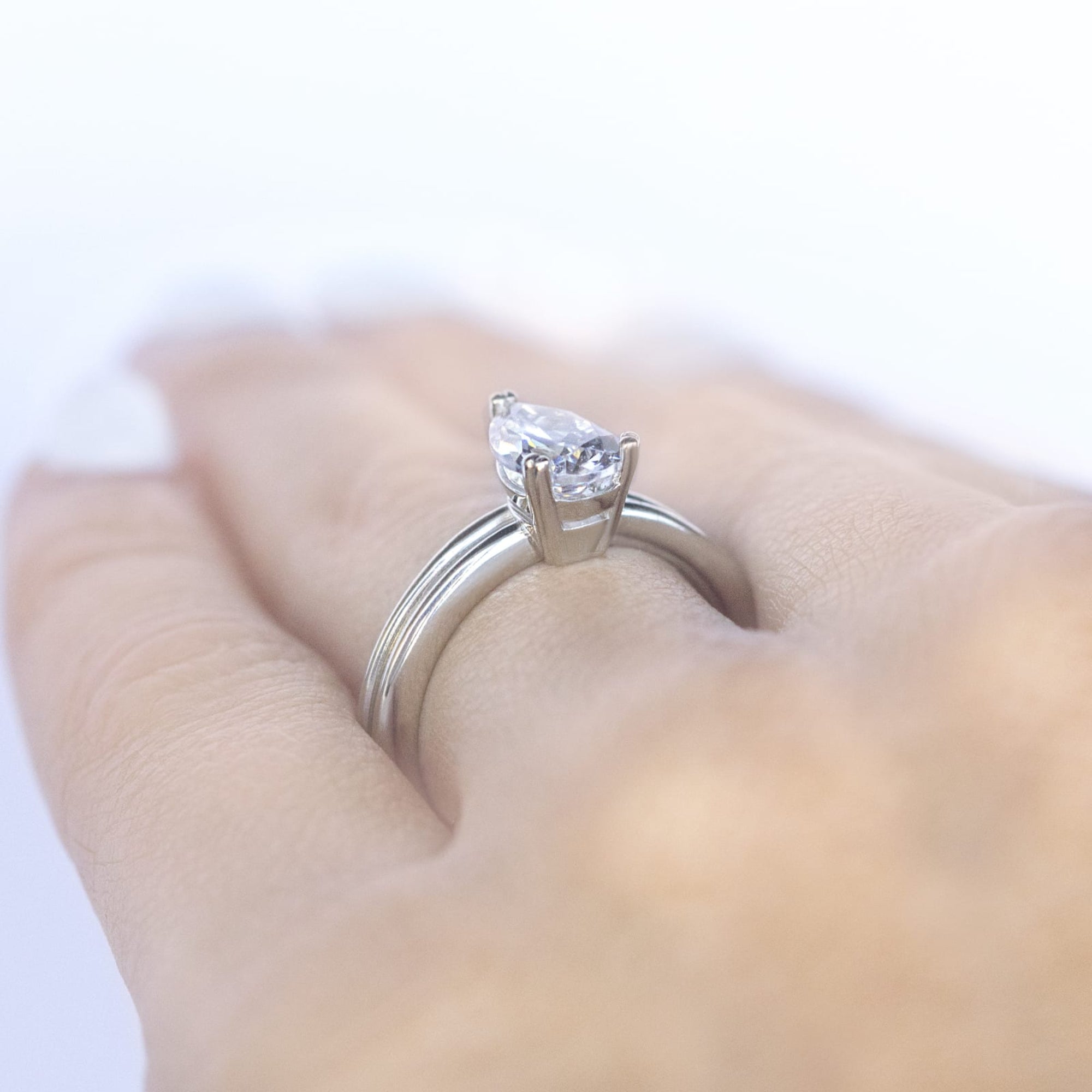 Sleek Shank Pear Cut Solitaire Engagement Ring