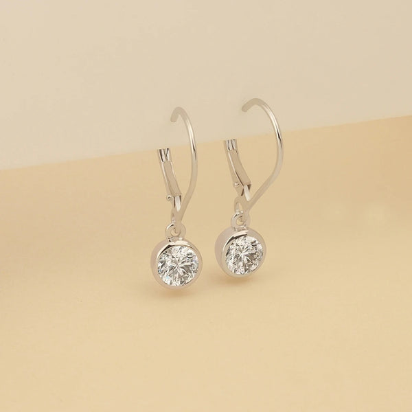 Minimalist Bezel Set Round Moissanite Dangle Earrings In 14K White Gold
