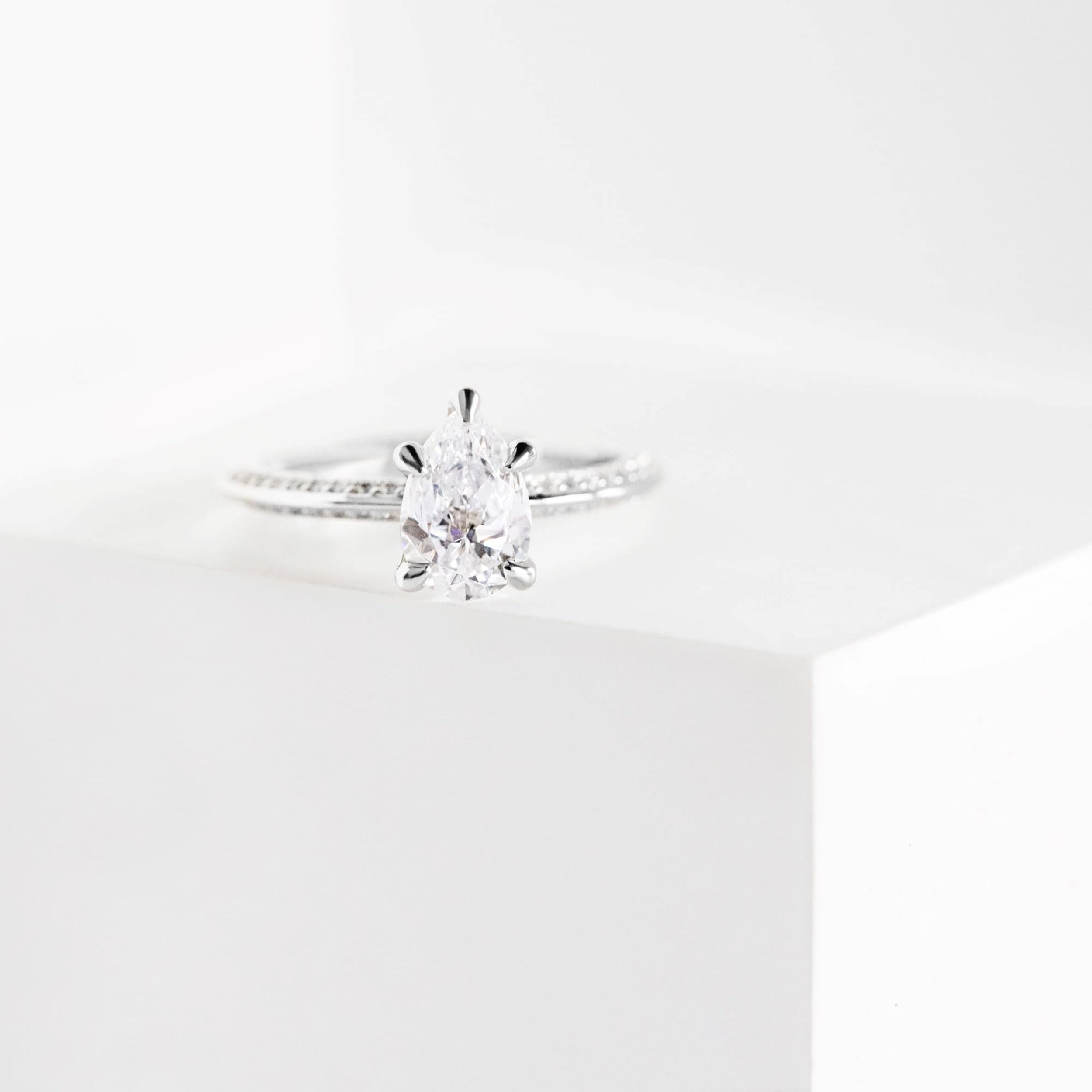 Knife Edge Pear Cut Pave Set Engagement Ring