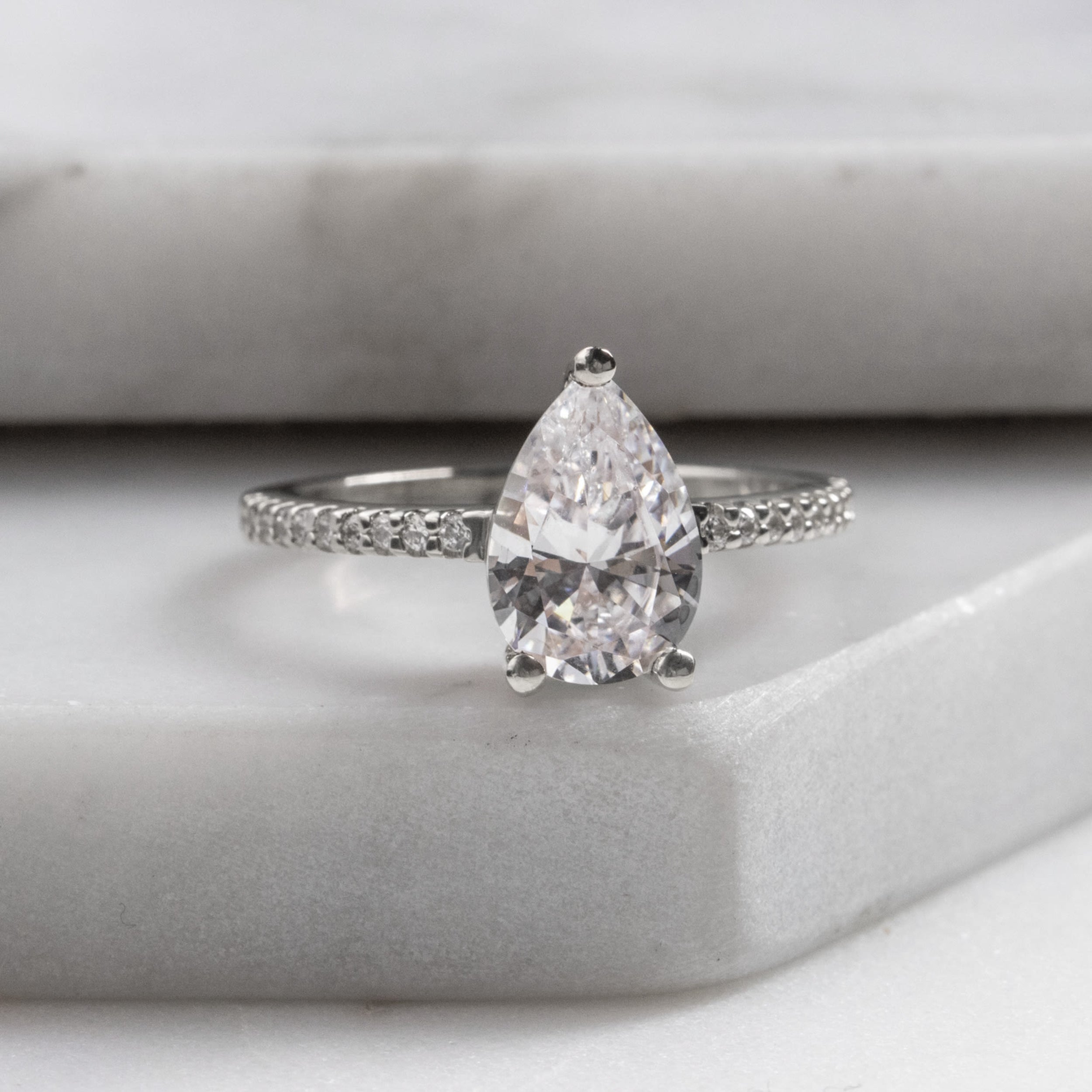 Basket Set Pear Cut Pave Set Moissanite Engagement Ring