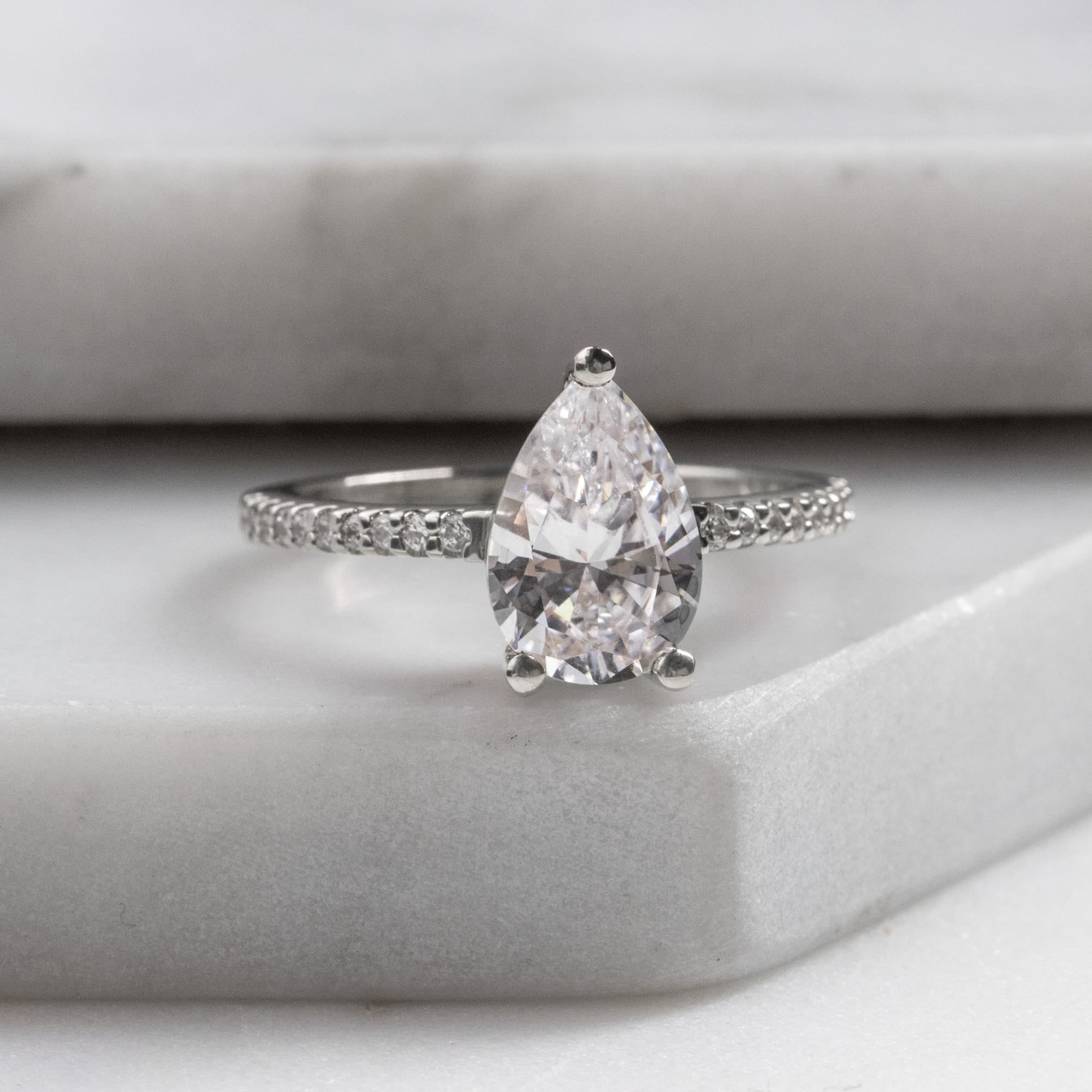 Pave Set Pear Cut Moissanite Engagement Ring