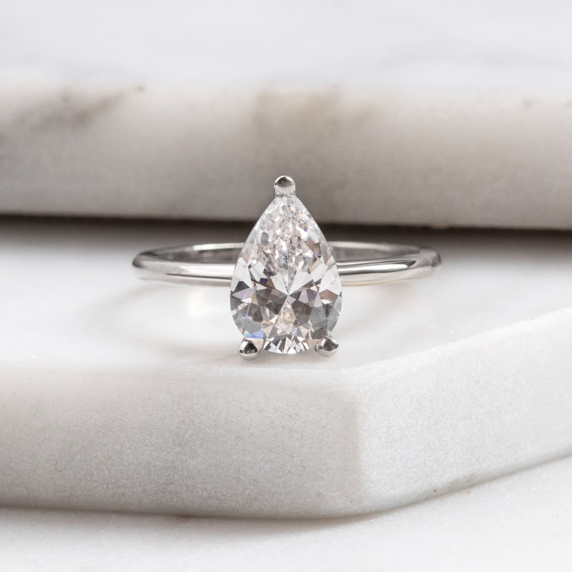 Pear Cut Basket Set Solitaire Engagement Ring