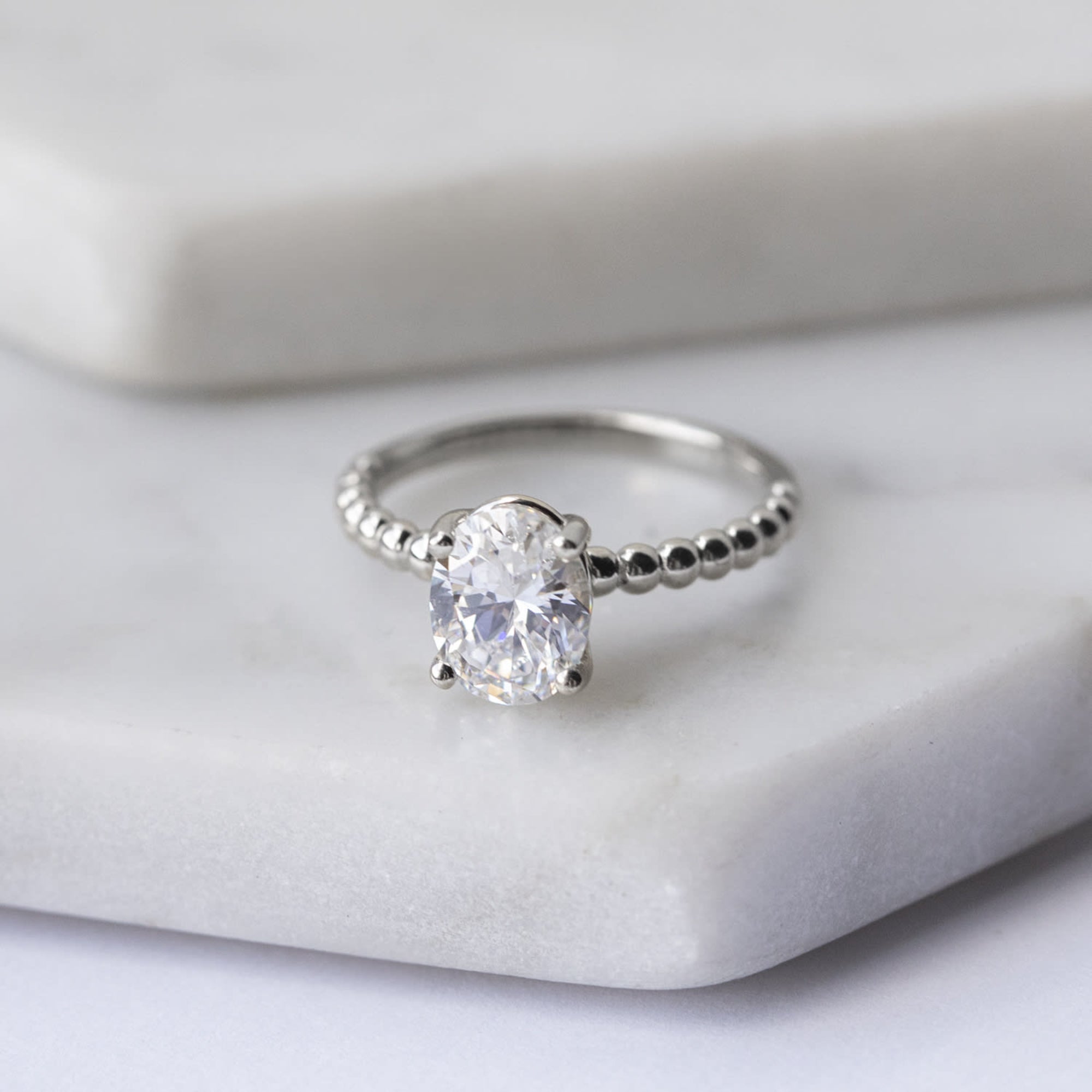 Oval Cut Beaded Solitaire Engagement Ring