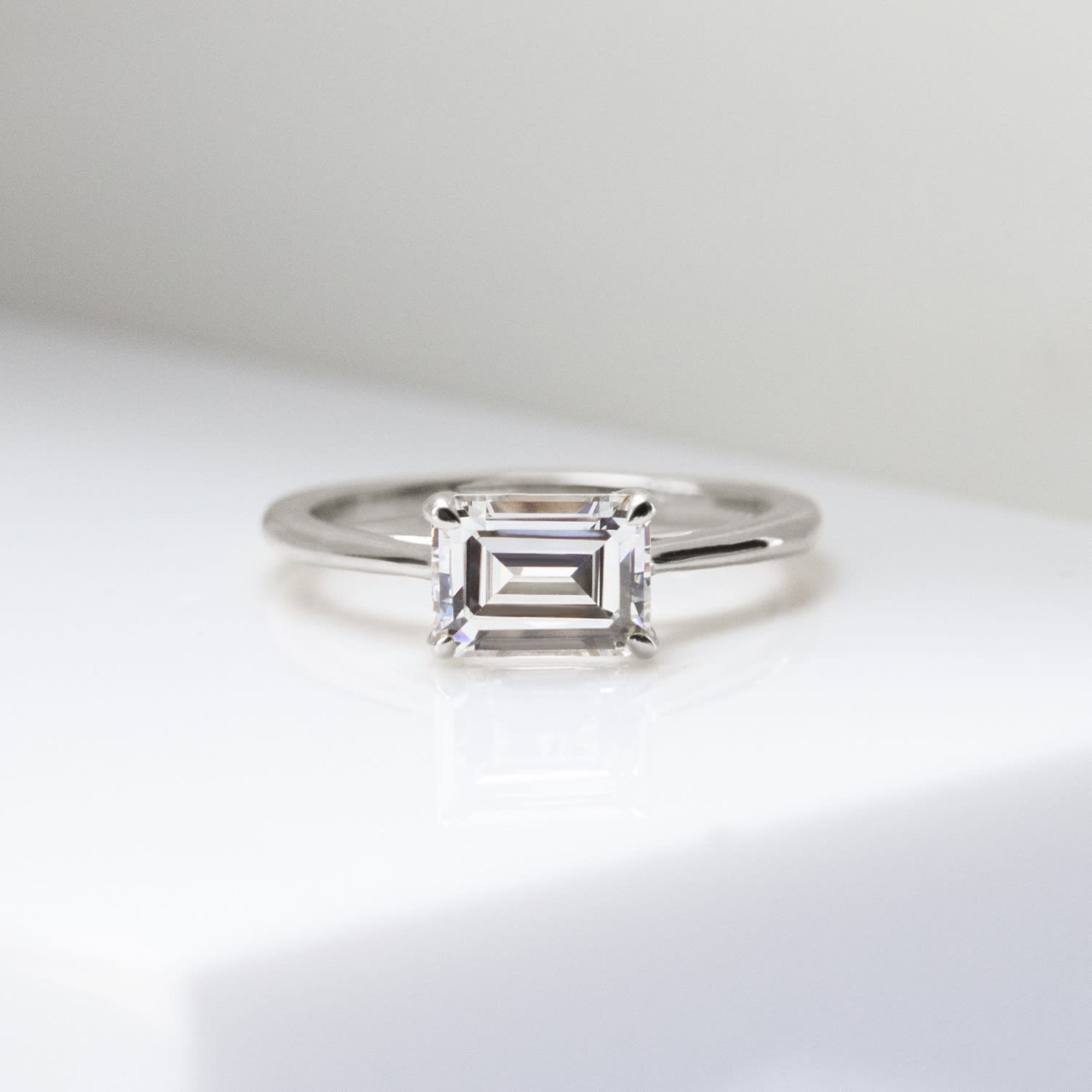 Moissanite Emerald Cut East to West Solitaire Engagement Ring