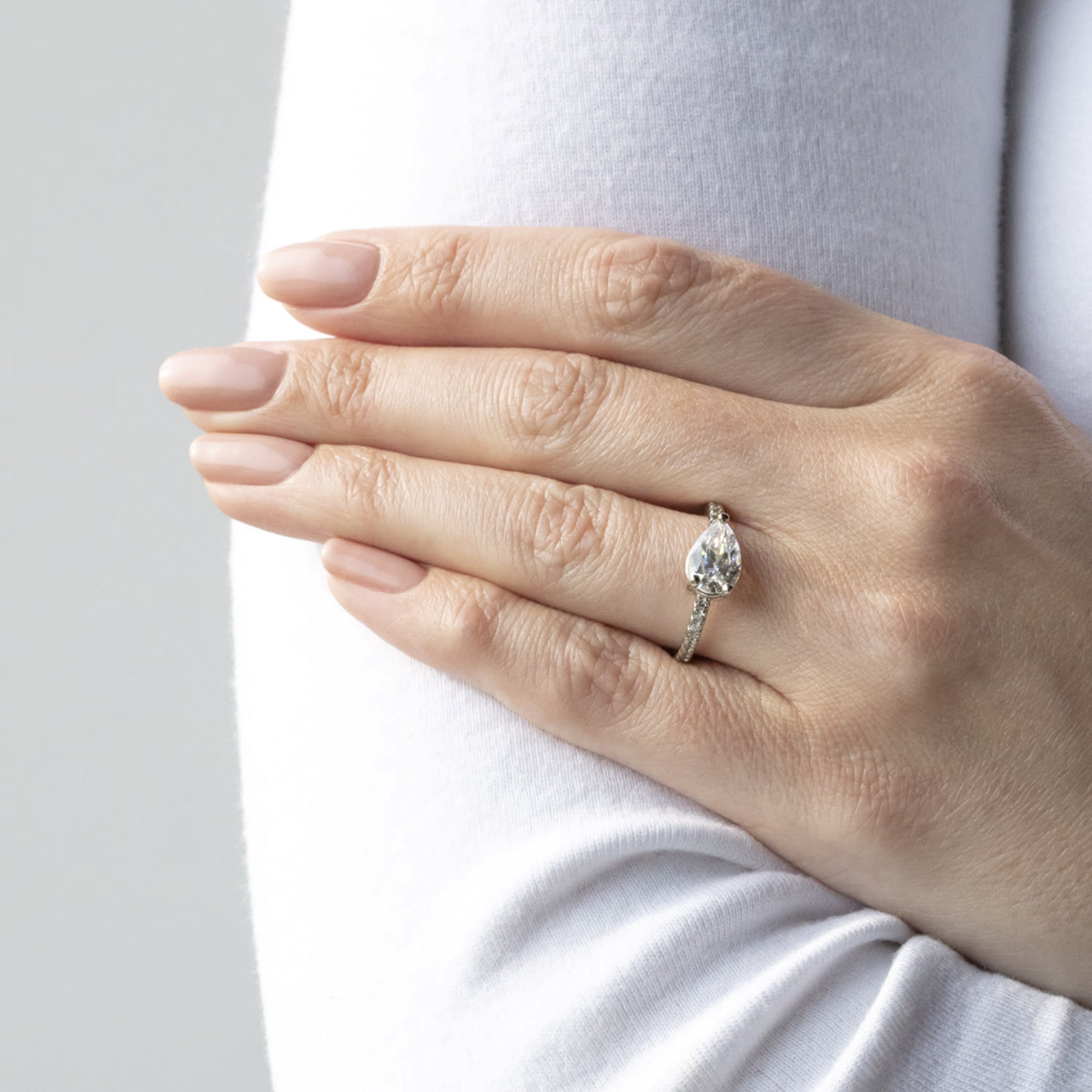 East to West Pear Cut Moissanite Pave Set Ring