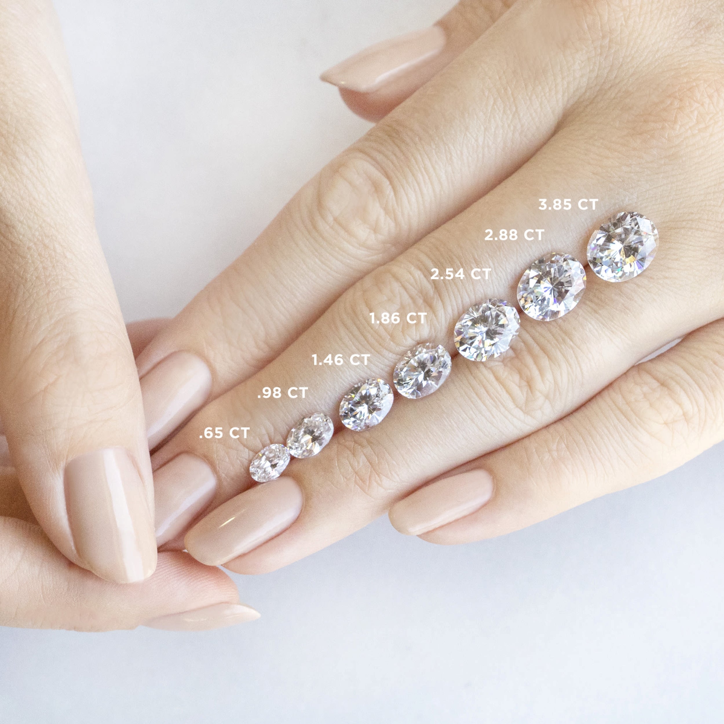 East to West Oval Cut Pave Set Engagement Ring