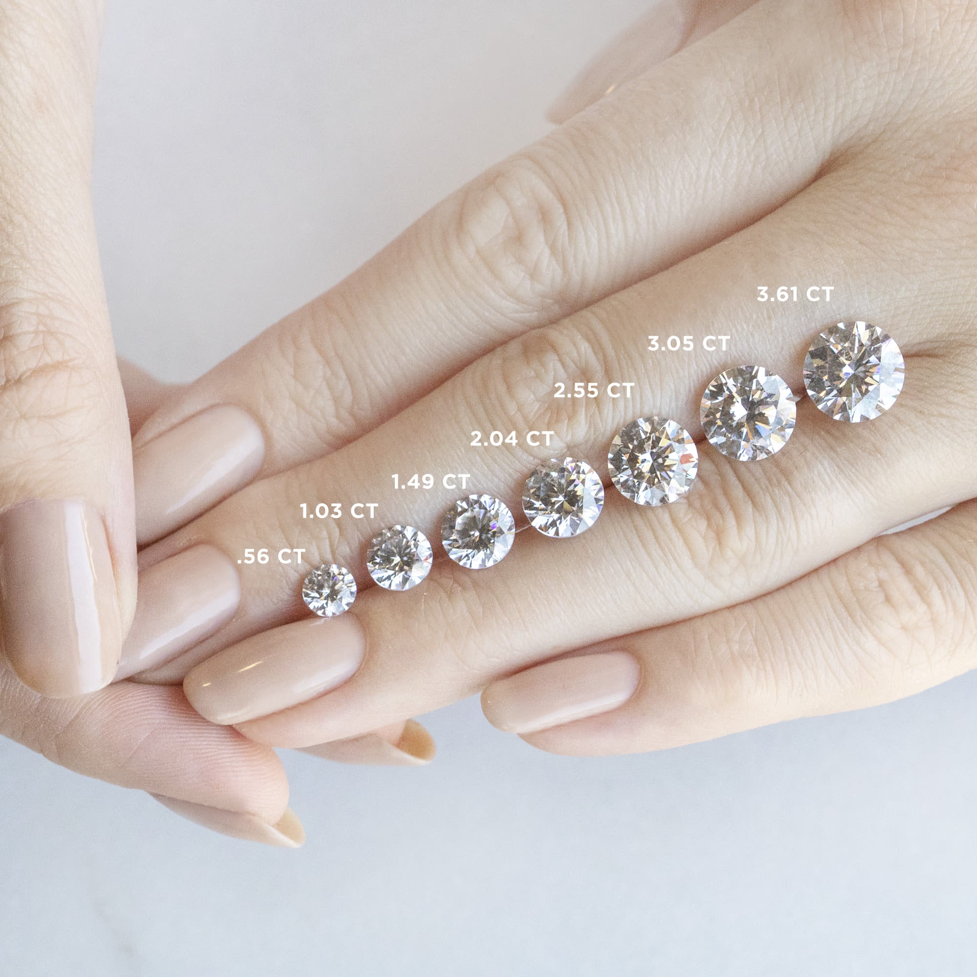 Trellis Set Round Cut Three Stone Engagement Ring