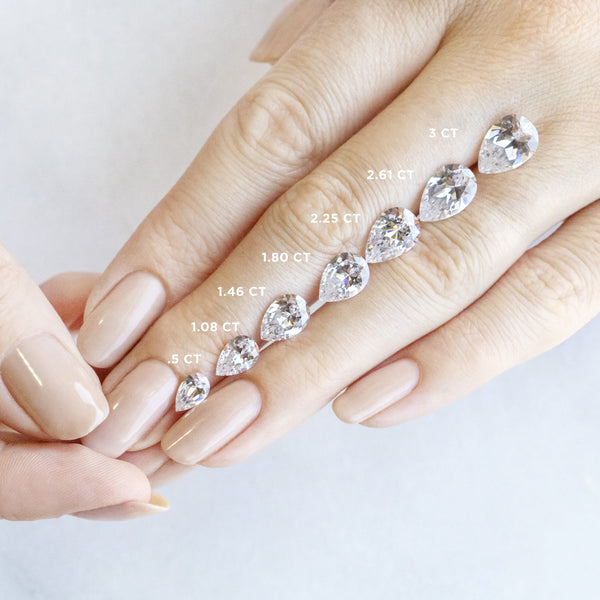 East to West Pear Cut Pave Set Engagement Ring